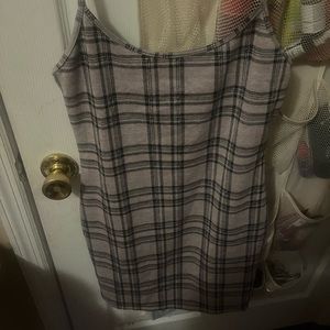 I am selling a plaid spaghetti strapped dress. Never worn.